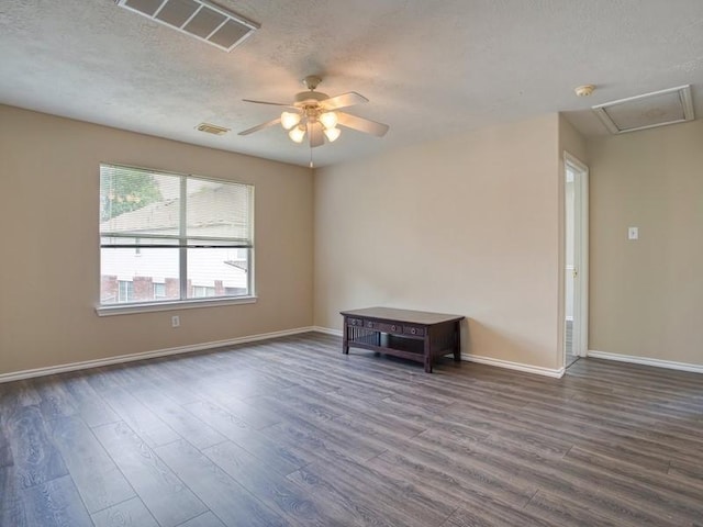 26610 W Surrey Park Ln W, Katy, TX 77494 - unfurnished room featuring dark wood-type flooring, a ceiling fan, a textured ceiling, and a smoke detector