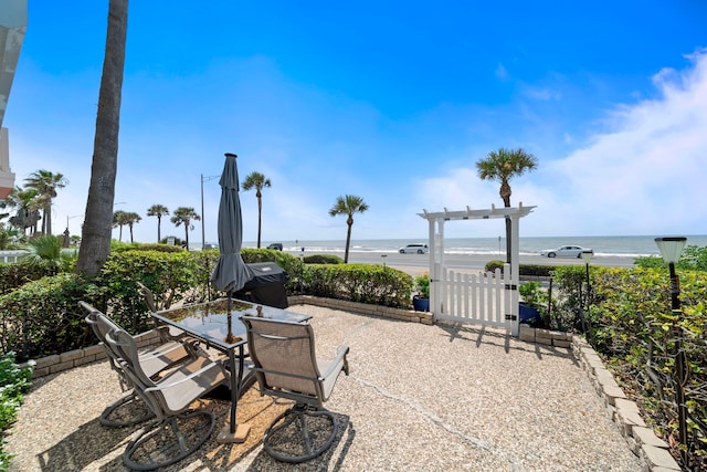 8416 Seawall Blvd Unit 5, Galveston, TX 77554 - view of patio / terrace featuring a water view and outdoor dining area