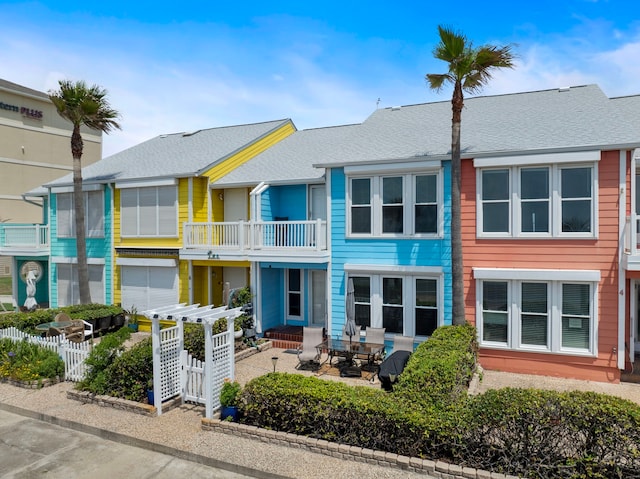 8416 Seawall Blvd Unit 5, Galveston, TX 77554 - multi unit property with a balcony, a patio, and roof with shingles