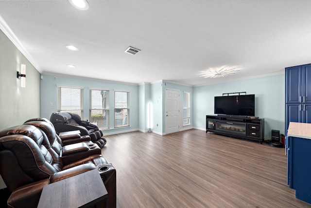 8416 Seawall Blvd Unit 5, Galveston, TX 77554 - living room featuring crown molding, wood finished floors, and recessed lighting