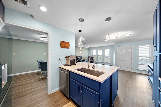 8416 Seawall Blvd Unit 5, Galveston, TX 77554 - kitchen with dishwasher, blue cabinetry, a peninsula, ornamental molding, and light wood-type flooring