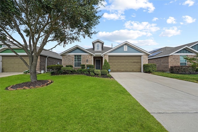 16330 Hillside Garden Ln, Houston, TX 77084 - traditional-style house featuring brick siding, driveway, a front lawn, and a garage