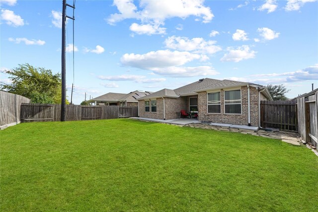 16330 Hillside Garden Ln, Houston, TX 77084 - back of house with a patio area, brick siding, and a fenced backyard