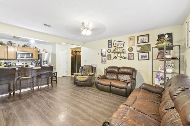 1732 Lynn Ln, Freeport, TX 77541 - living area featuring dark wood-type flooring and a ceiling fan
