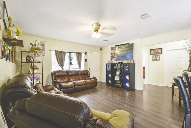 1732 Lynn Ln, Freeport, TX 77541 - living room featuring a ceiling fan and dark wood-style flooring