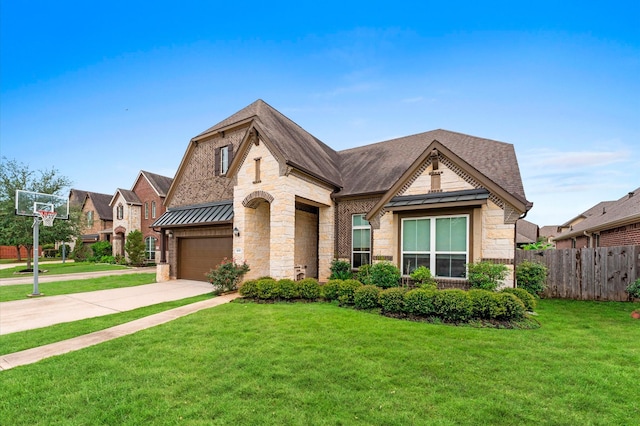 4110 Willow Wind Ct, Sugar Land, TX 77479 - view of front facade with stone siding, driveway, a standing seam roof, an attached garage, and a metal roof