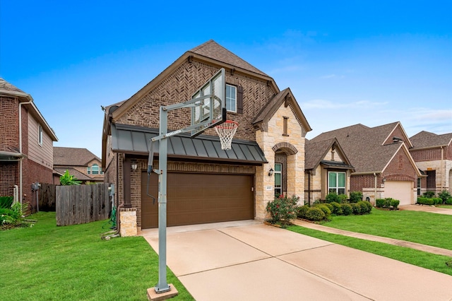 4110 Willow Wind Ct, Sugar Land, TX 77479 - view of front of house with brick siding, concrete driveway, a garage, a standing seam roof, and stone siding