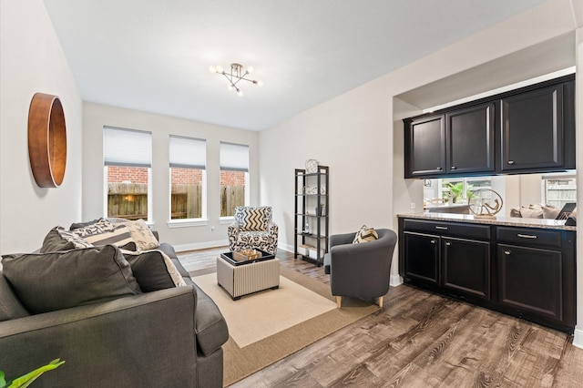 4110 Willow Wind Ct, Sugar Land, TX 77479 - living room featuring wood finished floors, plenty of natural light, and a chandelier