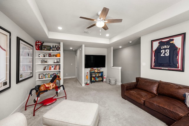 915 Bernard Meadows Dr, East Bernard, TX 77435 - carpeted living room with a ceiling fan, recessed lighting, and a raised ceiling