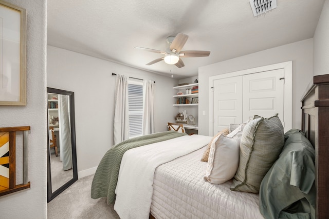 915 Bernard Meadows Dr, East Bernard, TX 77435 - bedroom with light carpet, a closet, and a ceiling fan