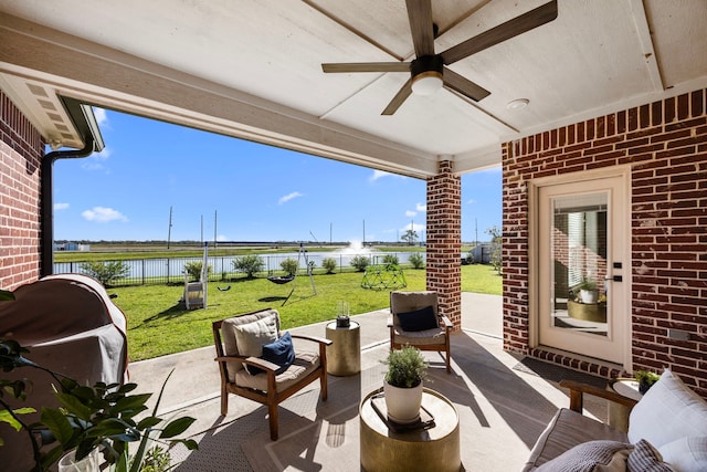 915 Bernard Meadows Dr, East Bernard, TX 77435 - view of patio with a water view, a ceiling fan, an outdoor hangout area, and grilling area