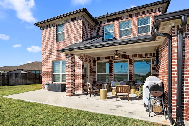 915 Bernard Meadows Dr, East Bernard, TX 77435 - rear view of house with brick siding, a ceiling fan, a patio, and an outdoor living space