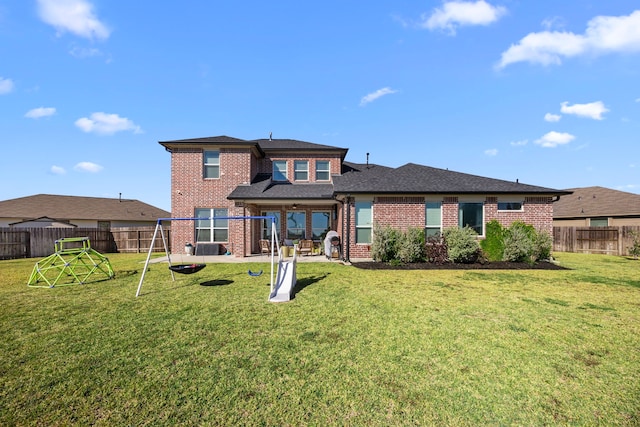 915 Bernard Meadows Dr, East Bernard, TX 77435 - rear view of house featuring brick siding and a fenced backyard