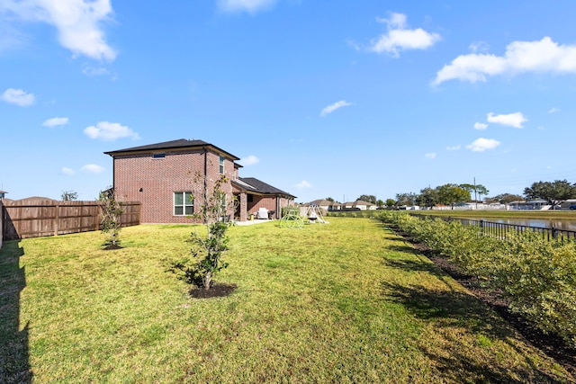 915 Bernard Meadows Dr, East Bernard, TX 77435 - fenced backyard featuring a water view