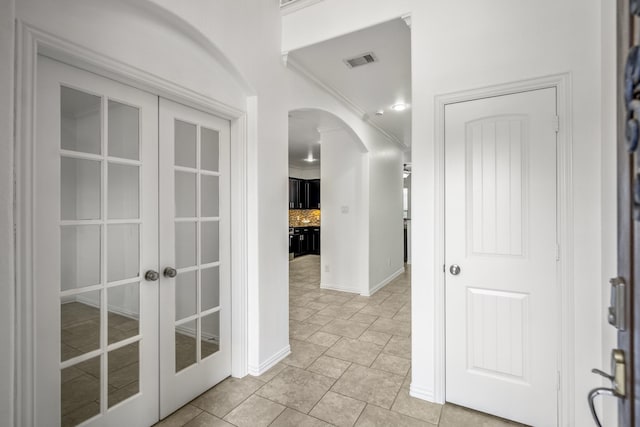 31767 Chapel Rock Ln, Spring, TX 77386 - corridor with french doors, arched walkways, and crown molding