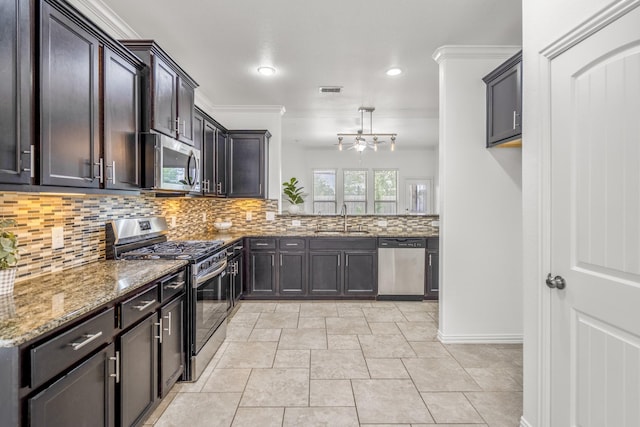 31767 Chapel Rock Ln, Spring, TX 77386 - kitchen featuring stainless steel appliances, light stone countertops, tasteful backsplash, recessed lighting, and dark brown cabinets