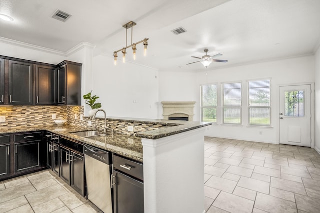 31767 Chapel Rock Ln, Spring, TX 77386 - kitchen featuring stainless steel dishwasher, a ceiling fan, dark stone counters, tasteful backsplash, and light tile patterned floors