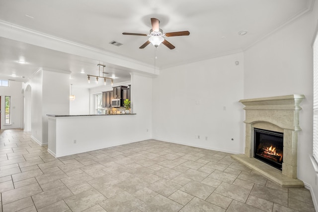 31767 Chapel Rock Ln, Spring, TX 77386 - unfurnished living room featuring ceiling fan, a fireplace, and ornamental molding