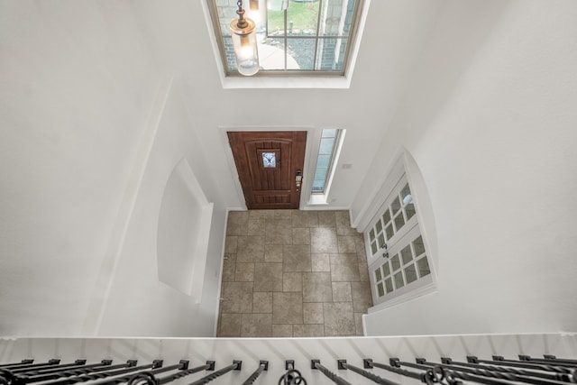 31767 Chapel Rock Ln, Spring, TX 77386 - entrance foyer featuring a towering ceiling and stone finish floors