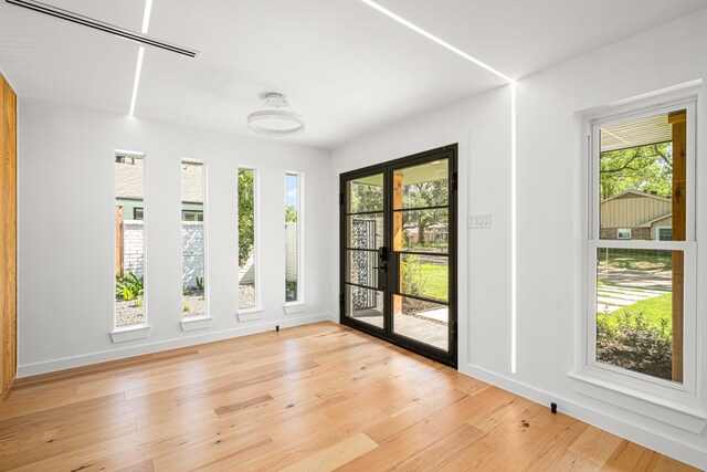 2506 Briarbrook Dr, Houston, TX 77042 - empty room featuring healthy amount of natural light and light wood-type flooring