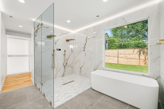 2506 Briarbrook Dr, Houston, TX 77042 - bathroom featuring a soaking tub, a marble finish shower, radiator heating unit, and recessed lighting