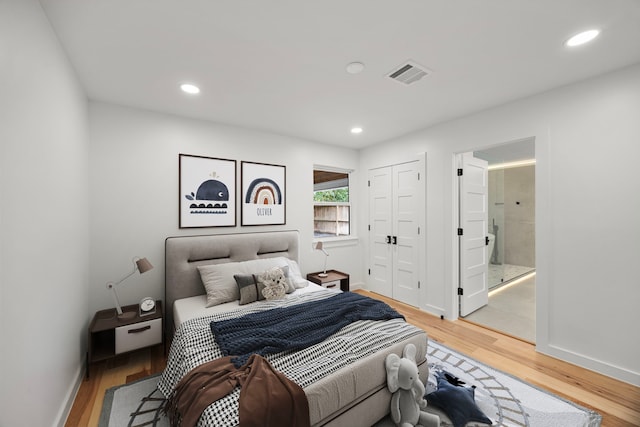 2506 Briarbrook Dr, Houston, TX 77042 - bedroom with light wood-type flooring, recessed lighting, and connected bathroom