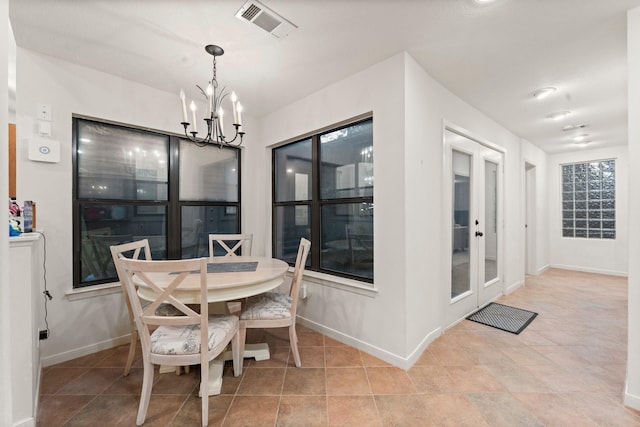 111 Mesa Ct, Conroe, TX 77304 - dining room with a chandelier and baseboards