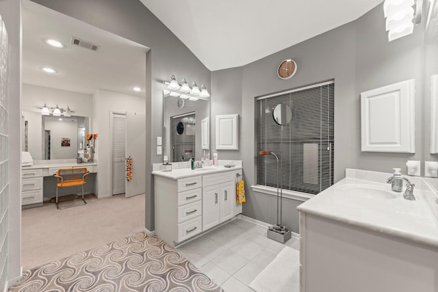 111 Mesa Ct, Conroe, TX 77304 - full bath featuring two vanities, recessed lighting, and lofted ceiling