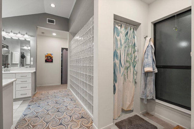 111 Mesa Ct, Conroe, TX 77304 - full bathroom featuring vanity, a shower with curtain, recessed lighting, tile patterned flooring, and vaulted ceiling