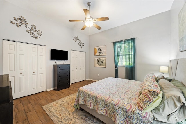 4842 Birch St, Santa Fe, TX 77517 - bedroom with two closets, wood finished floors, and ceiling fan