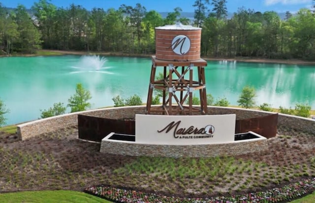 16031 Tangled Vine Ln, Conroe, TX 77378 - community sign featuring a water view