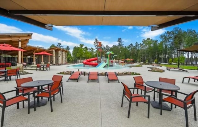 16031 Tangled Vine Ln, Conroe, TX 77378 - surrounding community with a patio