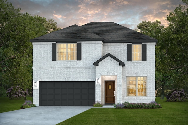 16031 Tangled Vine Ln, Conroe, TX 77378 - view of front facade with a lawn, an attached garage, and concrete driveway