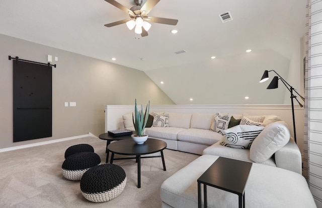 16031 Tangled Vine Ln, Conroe, TX 77378 - carpeted living area featuring ceiling fan, a barn door, lofted ceiling, and recessed lighting