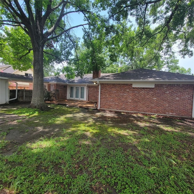 5227 Imogene St, Houston, TX 77096 - rear view of property with brick siding and a chimney
