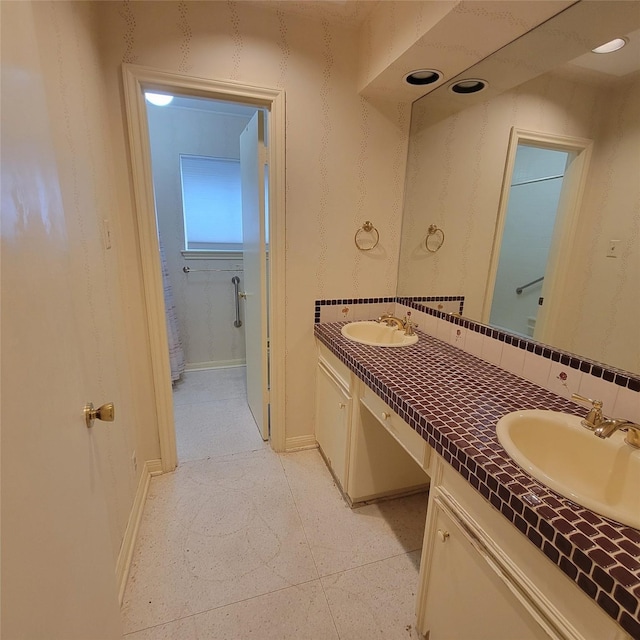 5227 Imogene St, Houston, TX 77096 - full bath with double vanity and baseboards