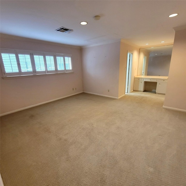 5227 Imogene St, Houston, TX 77096 - empty room featuring crown molding, recessed lighting, light colored carpet, and a smoke detector