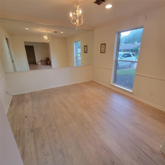 5227 Imogene St, Houston, TX 77096 - empty room featuring a chandelier, wood finished floors, healthy amount of natural light, and recessed lighting