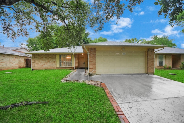 10731 Forest Leaf Dr, Sugar Land, TX 77498 - ranch-style house with driveway, an attached garage, brick siding, and a front lawn