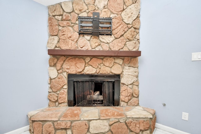 10731 Forest Leaf Dr, Sugar Land, TX 77498 - detailed view of baseboards and a stone fireplace