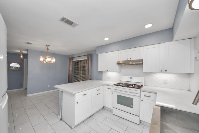 10731 Forest Leaf Dr, Sugar Land, TX 77498 - kitchen with gas range gas stove, under cabinet range hood, a peninsula, light marble finish flooring, and light countertops