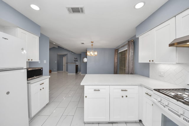 10731 Forest Leaf Dr, Sugar Land, TX 77498 - kitchen featuring white appliances, a peninsula, white cabinets, light countertops, and recessed lighting