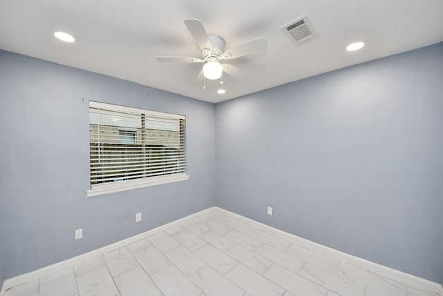 10731 Forest Leaf Dr, Sugar Land, TX 77498 - unfurnished room with a ceiling fan, marble look tiles, and recessed lighting