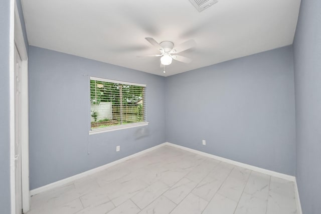 10731 Forest Leaf Dr, Sugar Land, TX 77498 - unfurnished room with light marble finish flooring and a ceiling fan