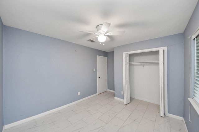10731 Forest Leaf Dr, Sugar Land, TX 77498 - unfurnished bedroom featuring light marble finish flooring, a closet, and a ceiling fan