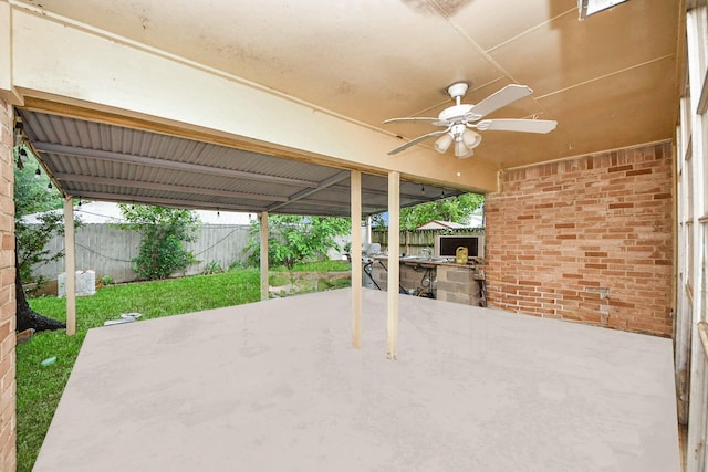 10731 Forest Leaf Dr, Sugar Land, TX 77498 - fenced backyard featuring area for grilling, a patio, and ceiling fan
