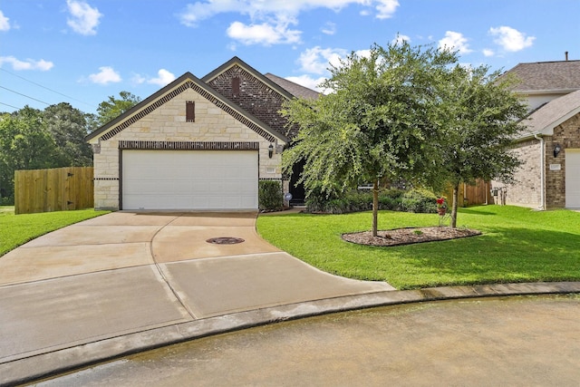 1203 Casal Springs Ct, Crosby, TX 77532 - view of front of house with driveway, stone siding, an attached garage, and brick siding