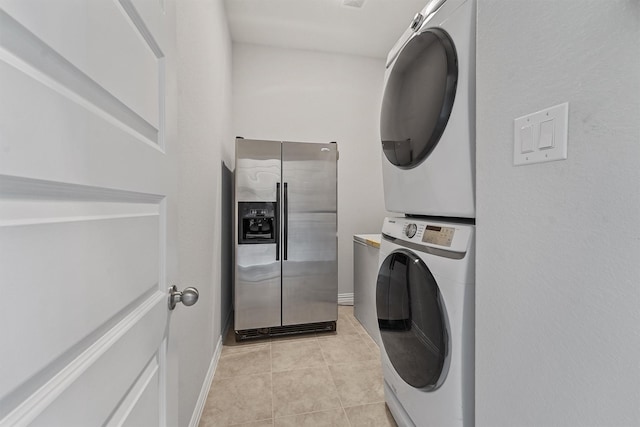 1203 Casal Springs Ct, Crosby, TX 77532 - laundry room featuring stacked washer and clothes dryer and light tile patterned flooring