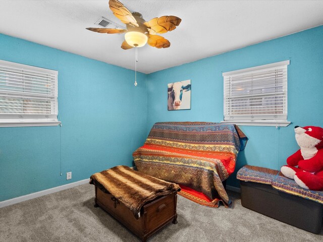 1901 49th St, Galveston, TX 77551 - carpeted bedroom featuring baseboards and ceiling fan