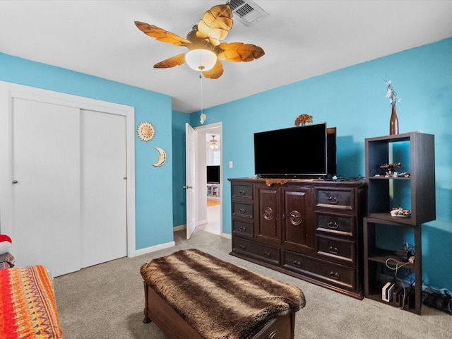 1901 49th St, Galveston, TX 77551 - bedroom with carpet floors, a closet, and a ceiling fan